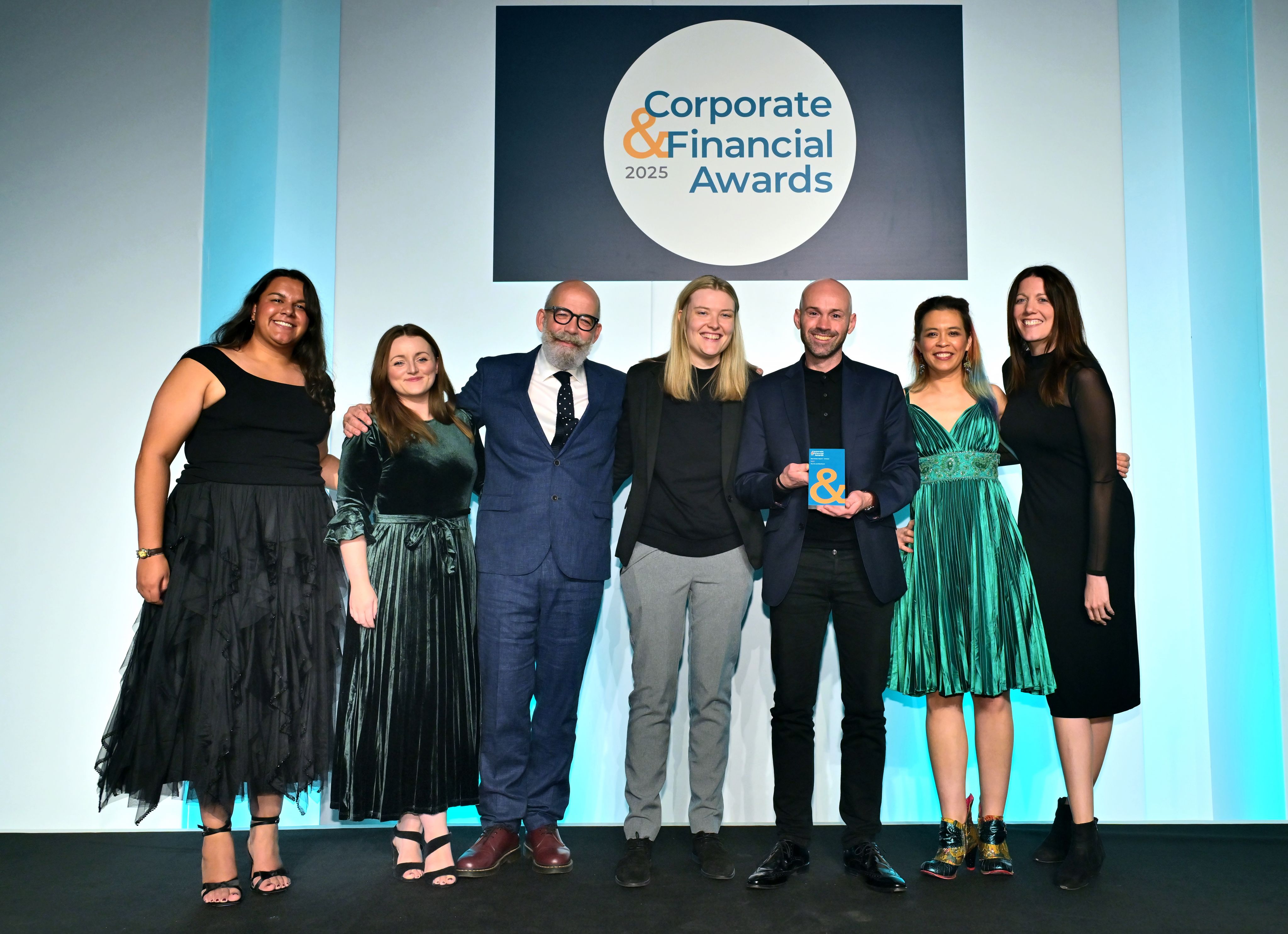 The FA, Shorthand, and Harpoon teams collect the Gold trophy at the awards night.