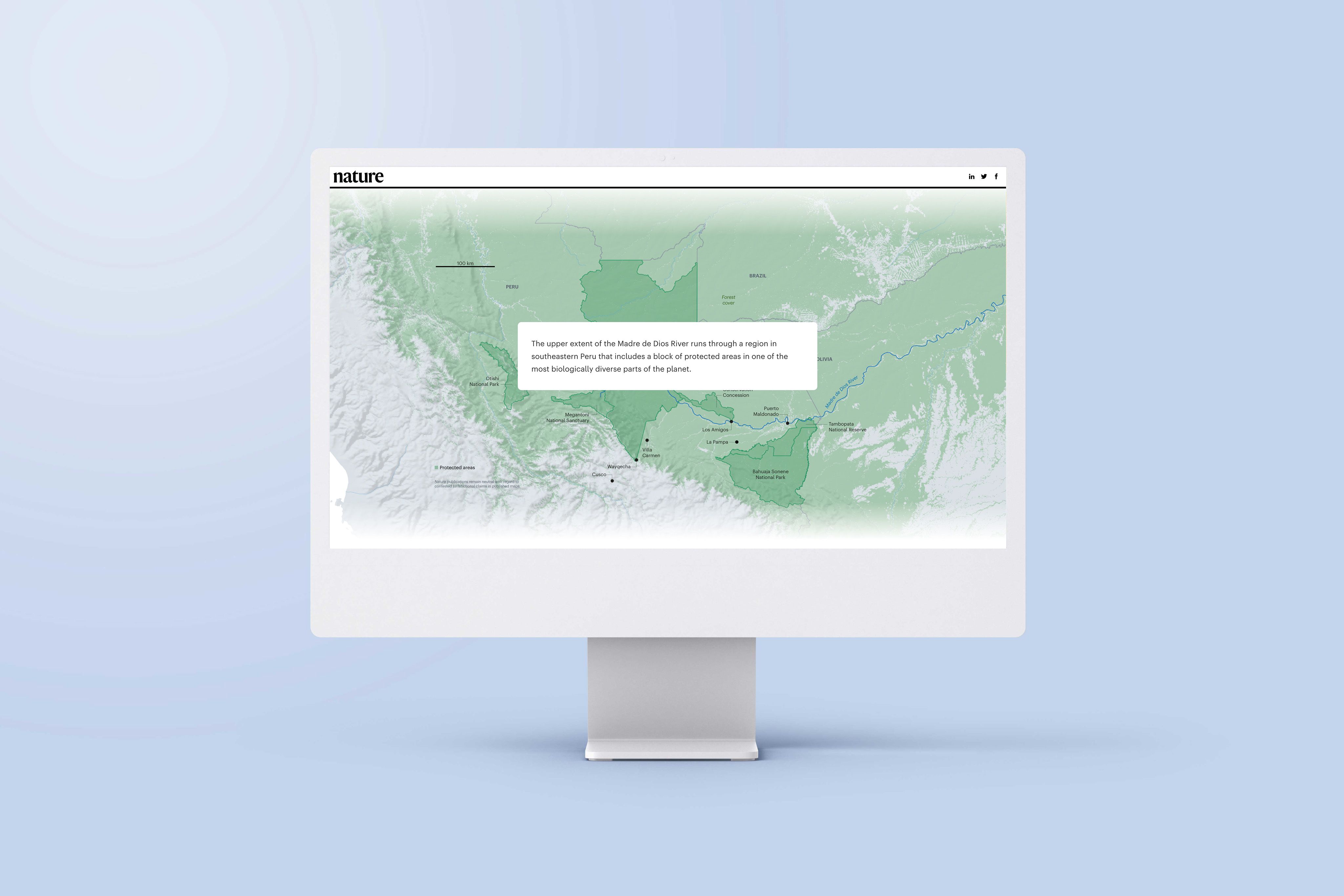 An image of a computer screen sitting on a desk. The screen is showing an example of an interactive map in the article 'The Last Stand in the Amazon'.