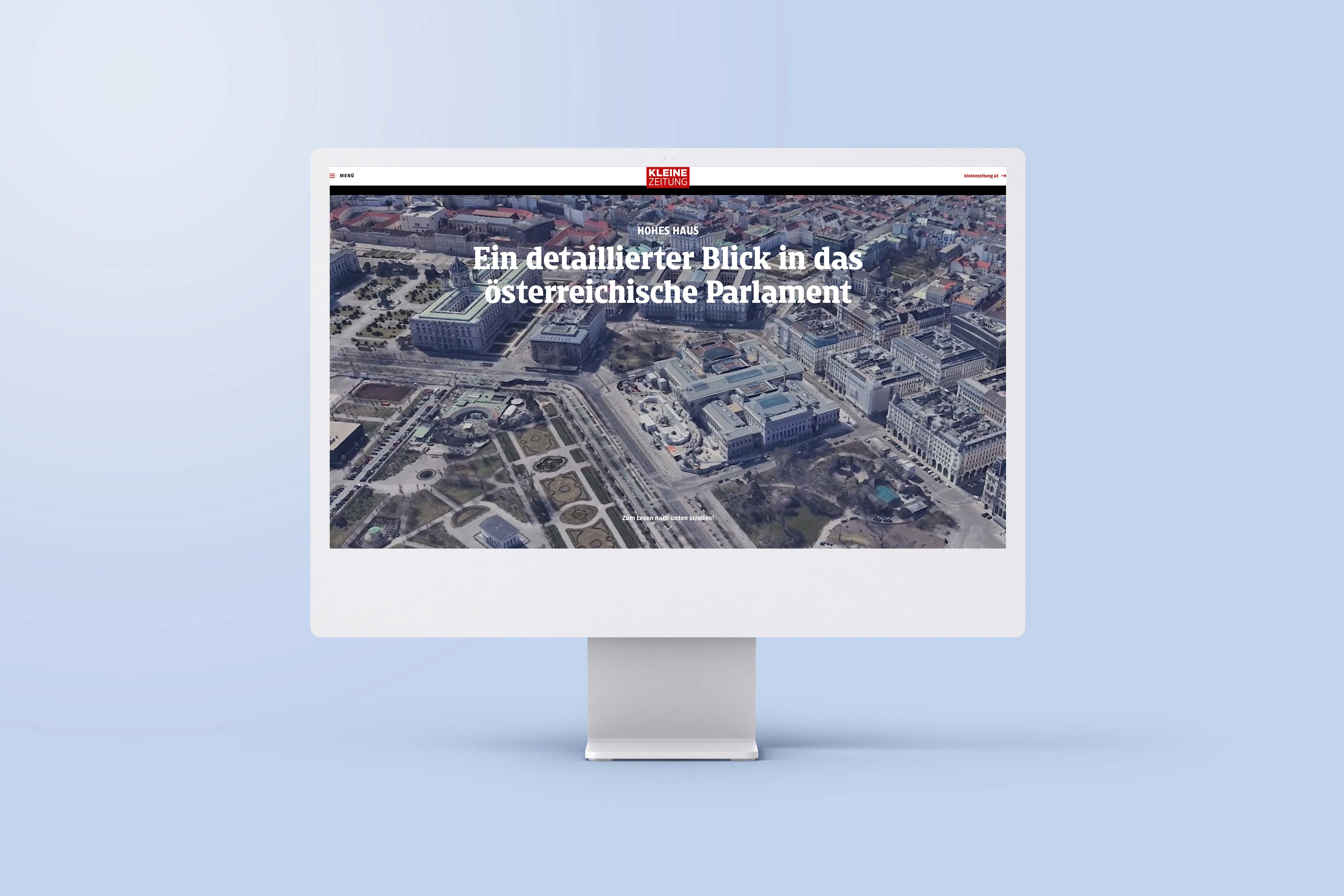 An image of a computer screen sitting on a desk. The screen is showing an example of an interactive map in the article 'A detailed look inside the Austrian Parliament'.