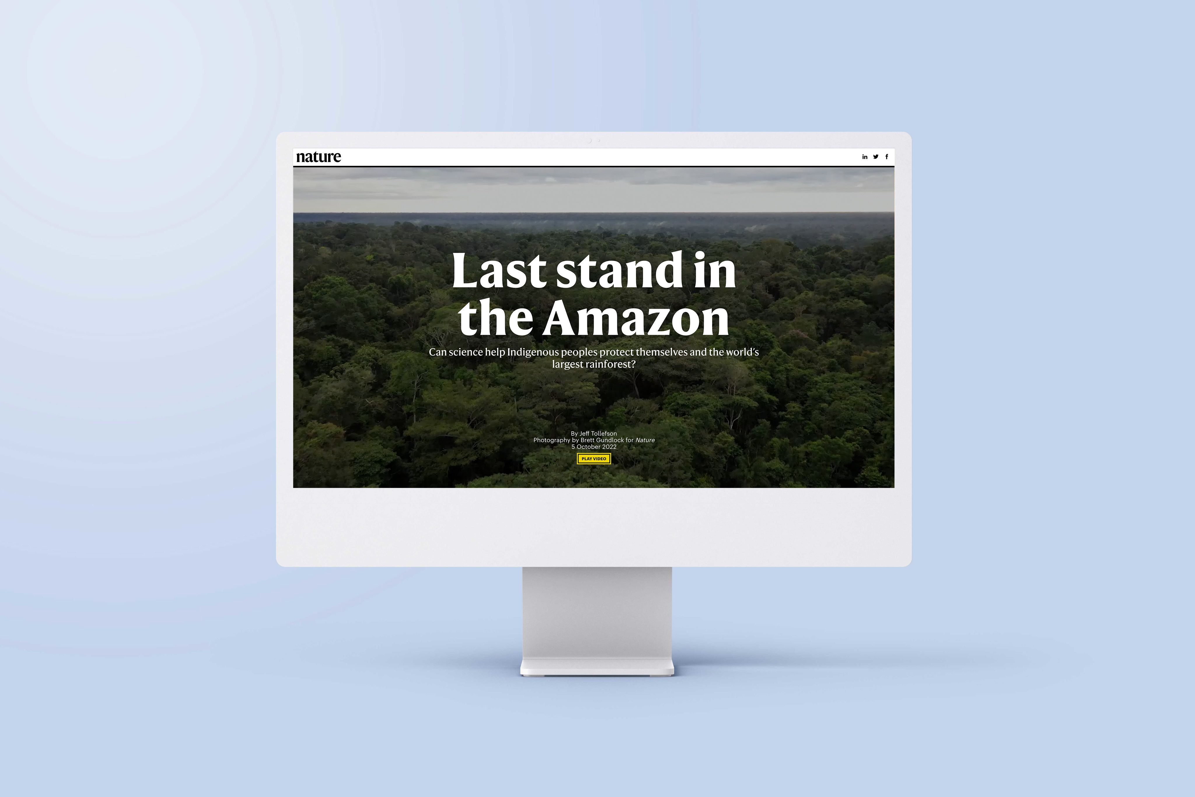 An image of a computer screen sitting on a desk. The screen is showing an example of an interactive map in the article 'Last stand in the Amazon'.