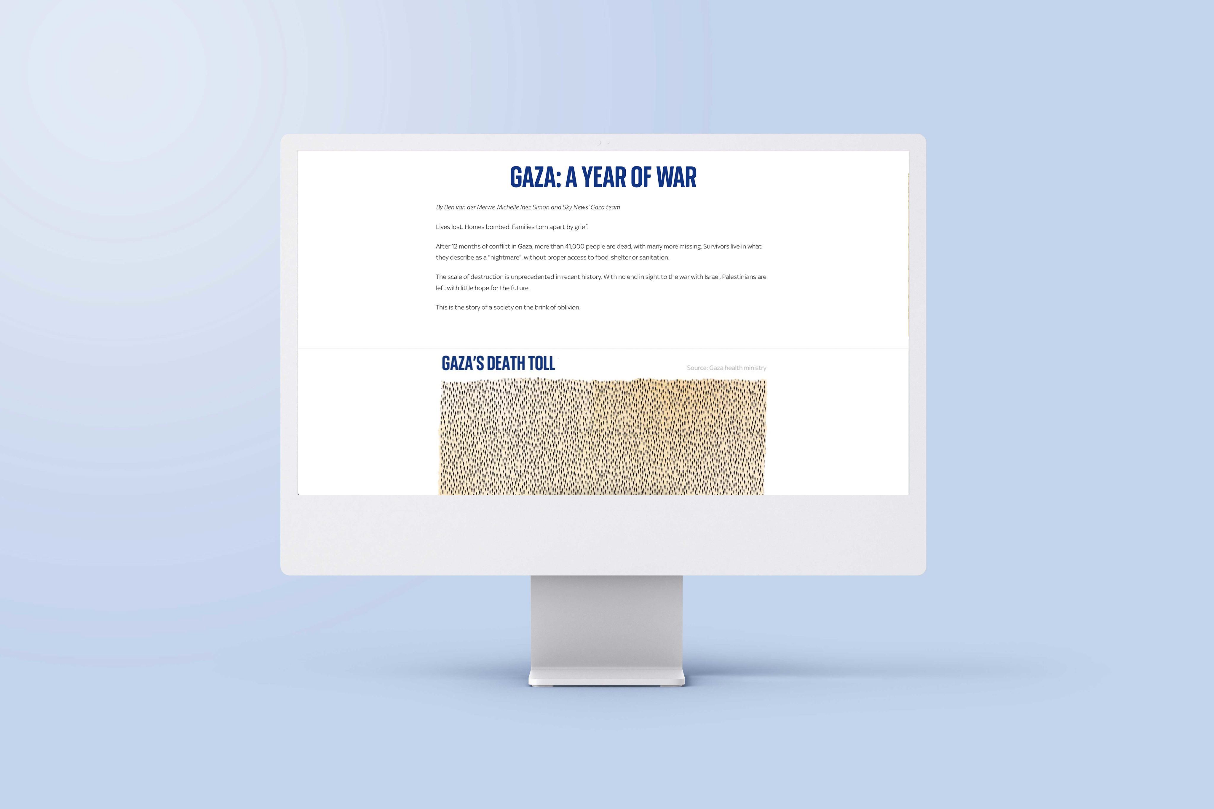 An image of a computer screen sitting on a desk. The screen is showing an example of an interactive map in the article 'Gaza: A year of war'.