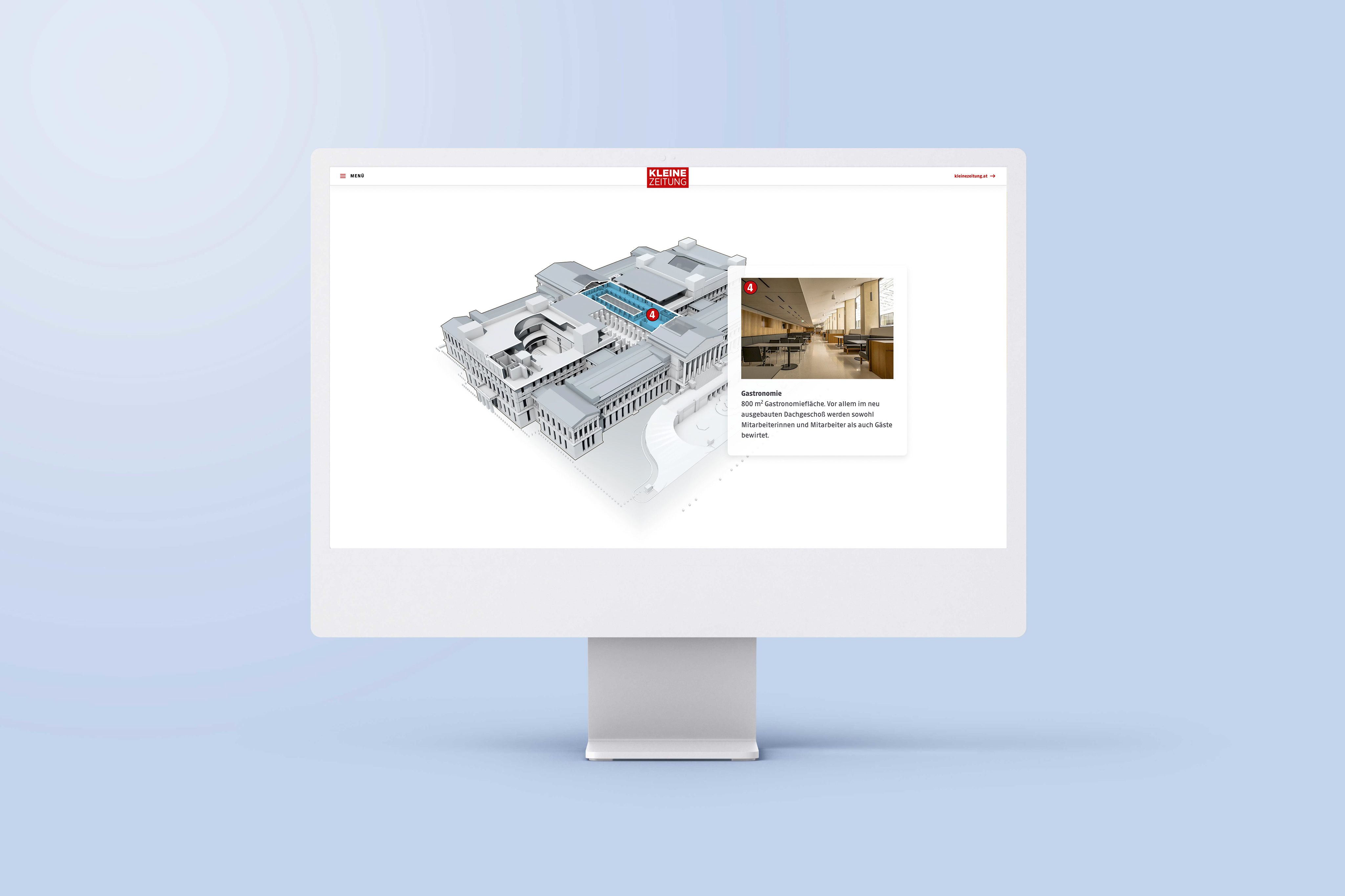 An image of a computer screen sitting on a desk. The screen is showing an example of an interactive map in the article 'A detailed look inside the Austrian Parliament'.