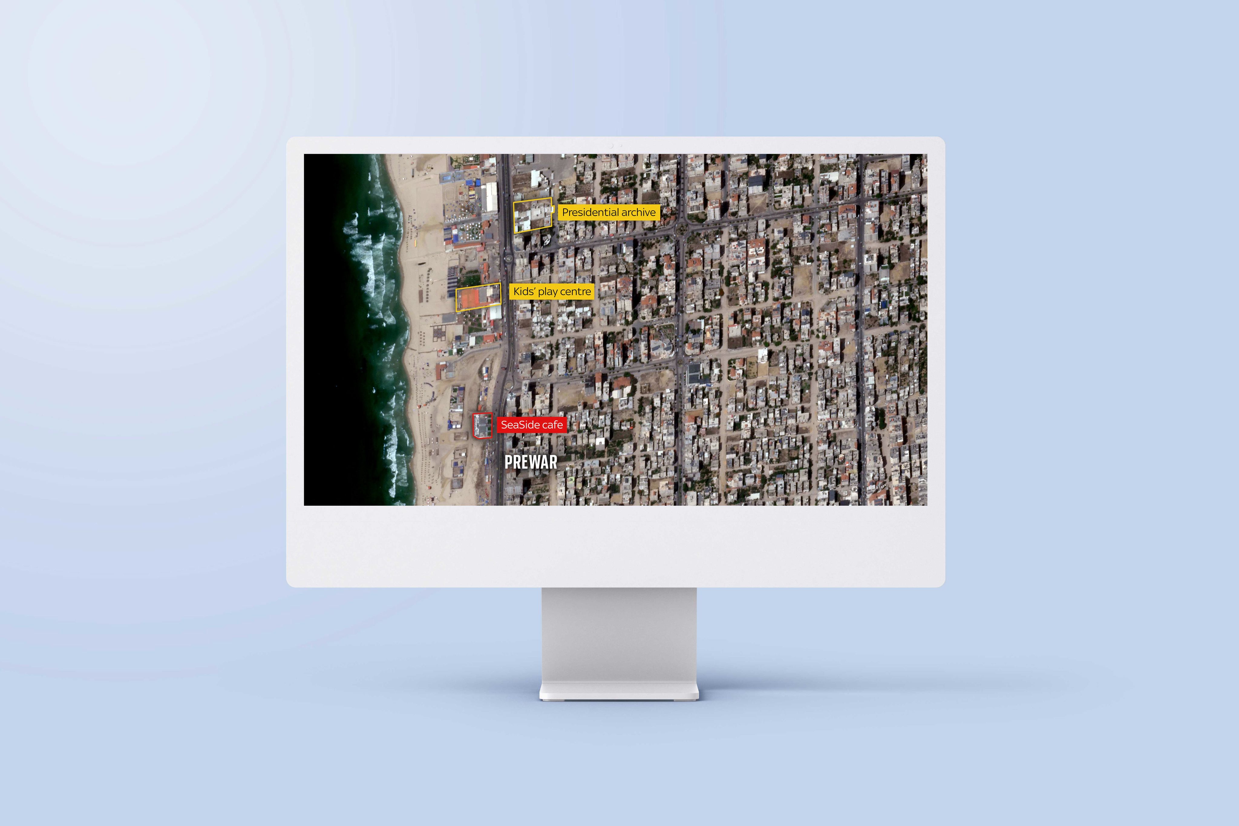 An image of a computer screen sitting on a desk. The screen is showing an example of an interactive map in the article 'Gaza: A year of war'.