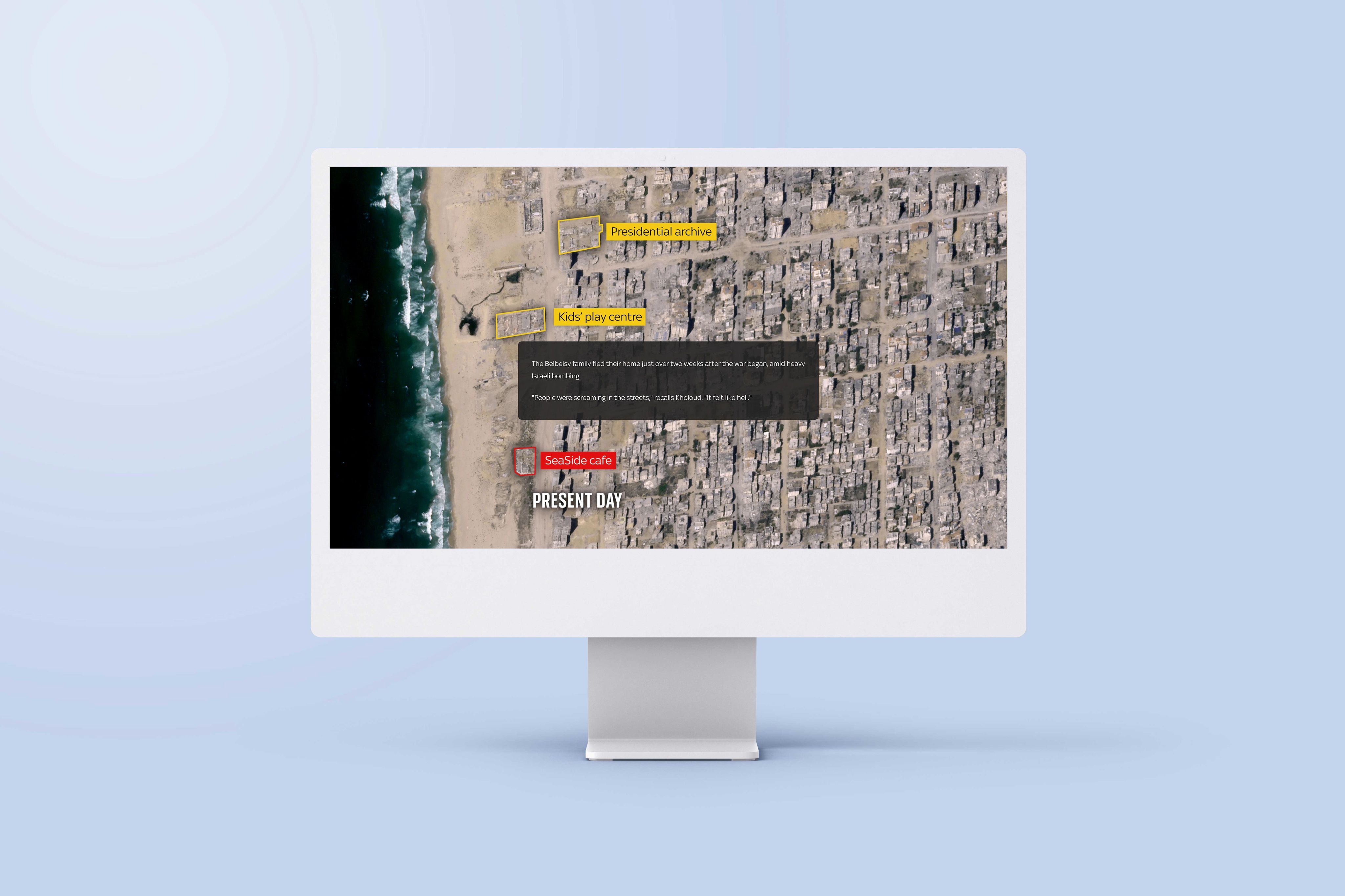 An image of a computer screen sitting on a desk. The screen is showing an example of an interactive map in the article 'Gaza: A year of war'.