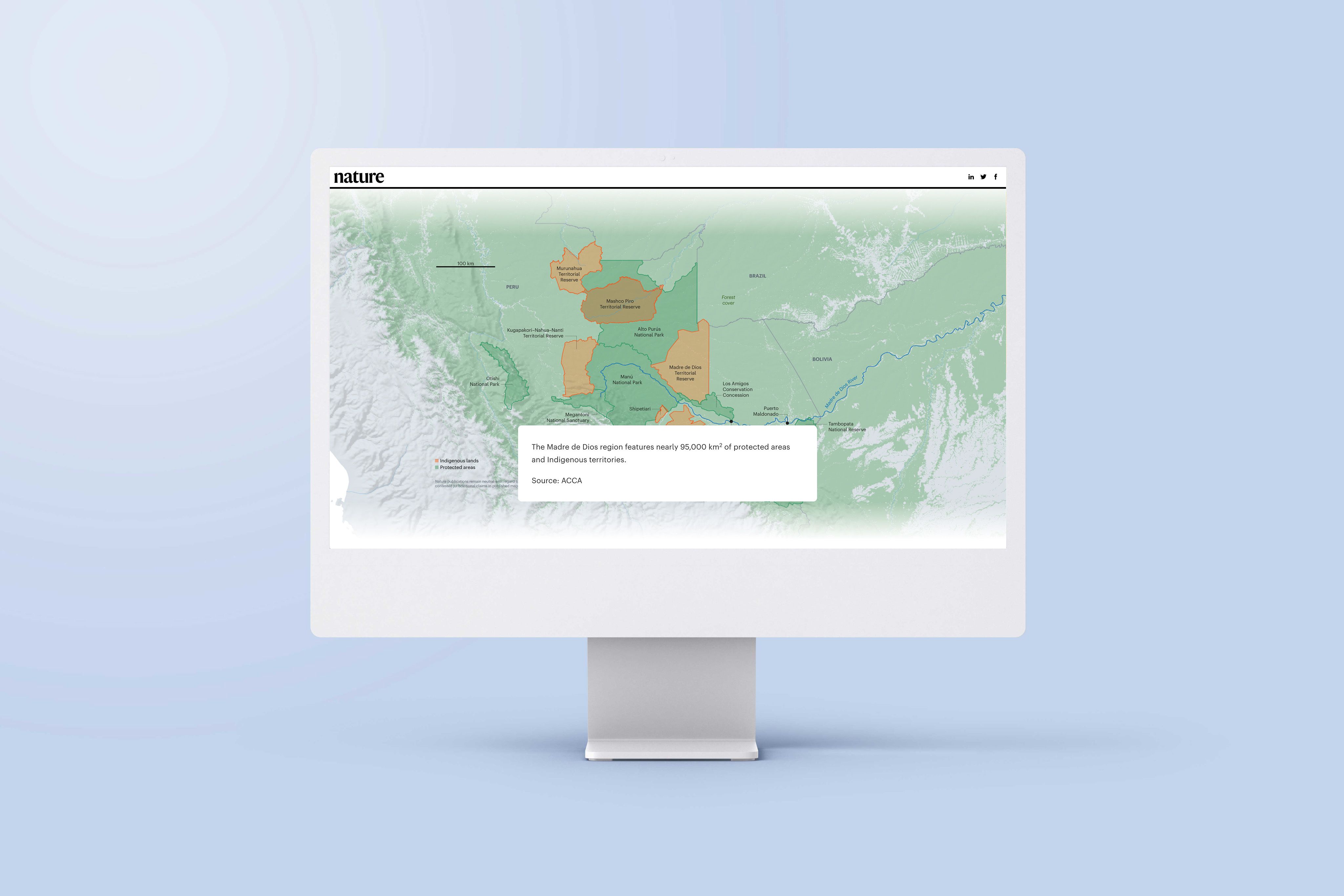 An image of a computer screen sitting on a desk. The screen is showing an example of an interactive map in the article 'The Last Stand in the Amazon'.