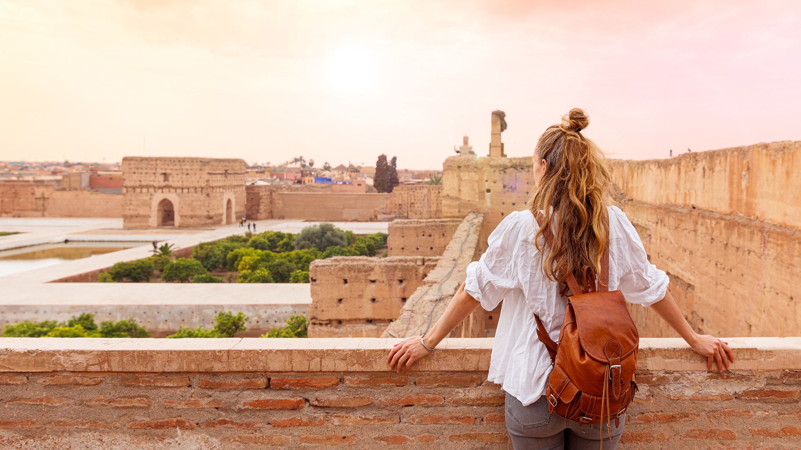 Woman looking out to ruins