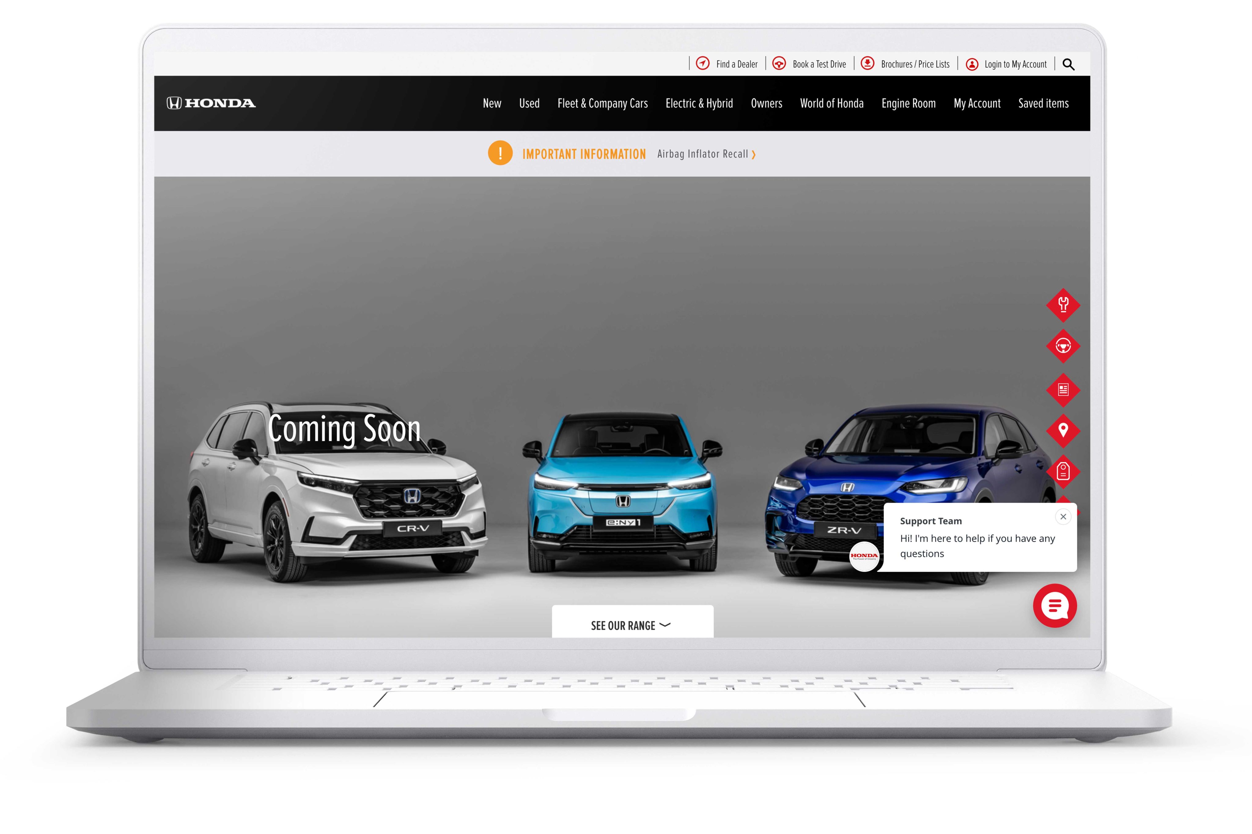 A laptop screen showing the homepage of the Honda website.