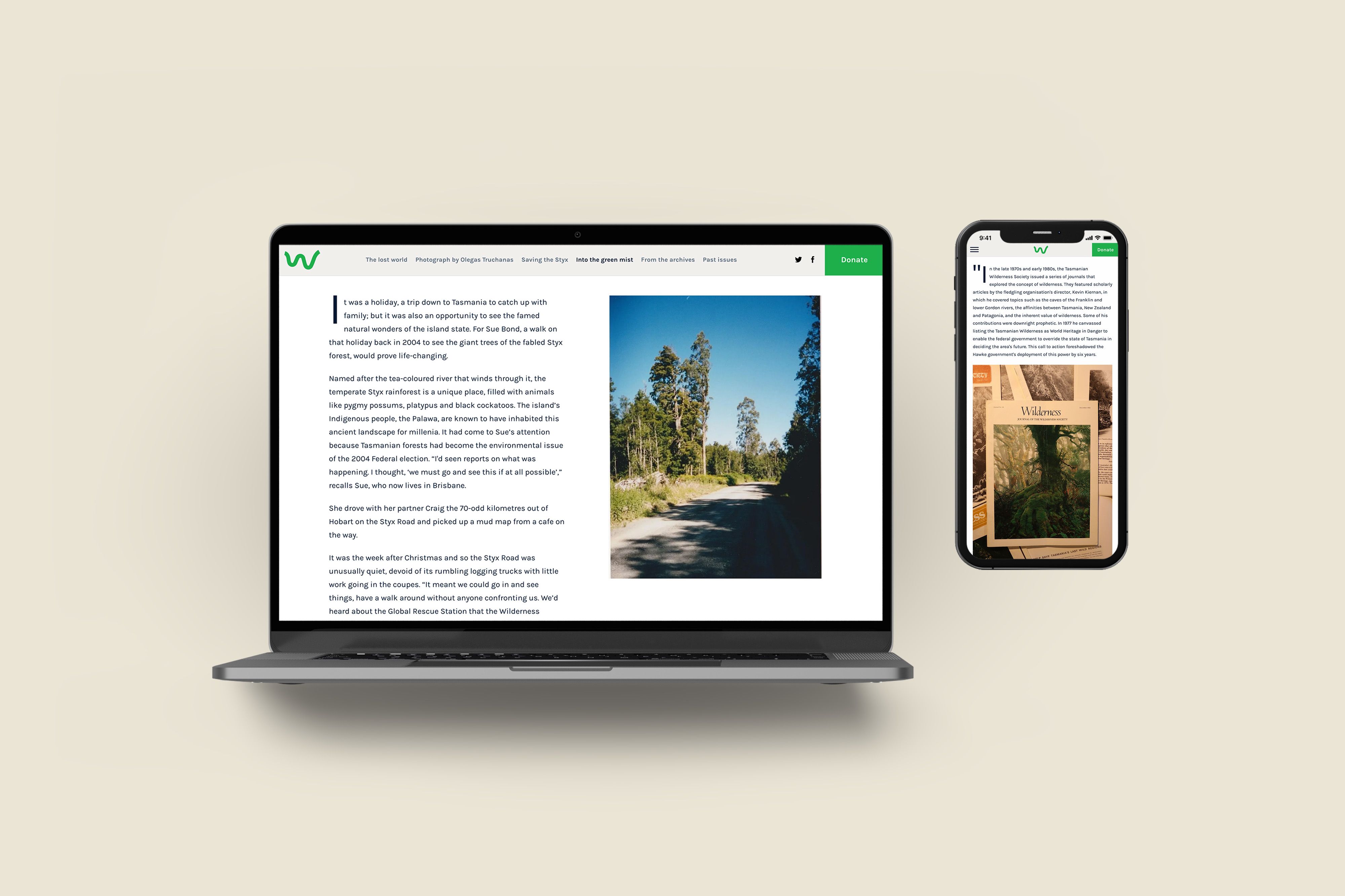 A laptop with a digital magazine by the Wilderness Journal on screen.