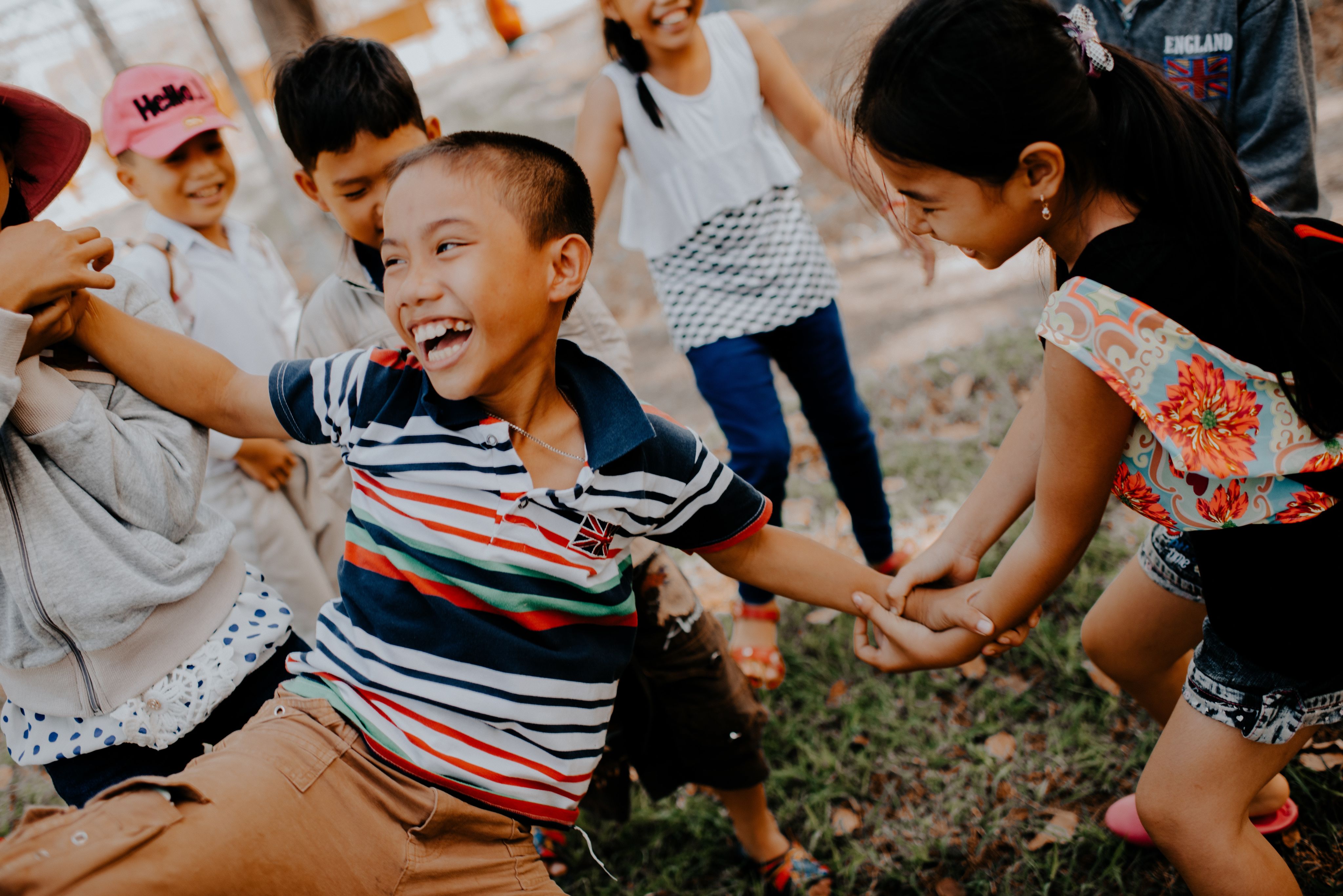 Boy playing with others outside