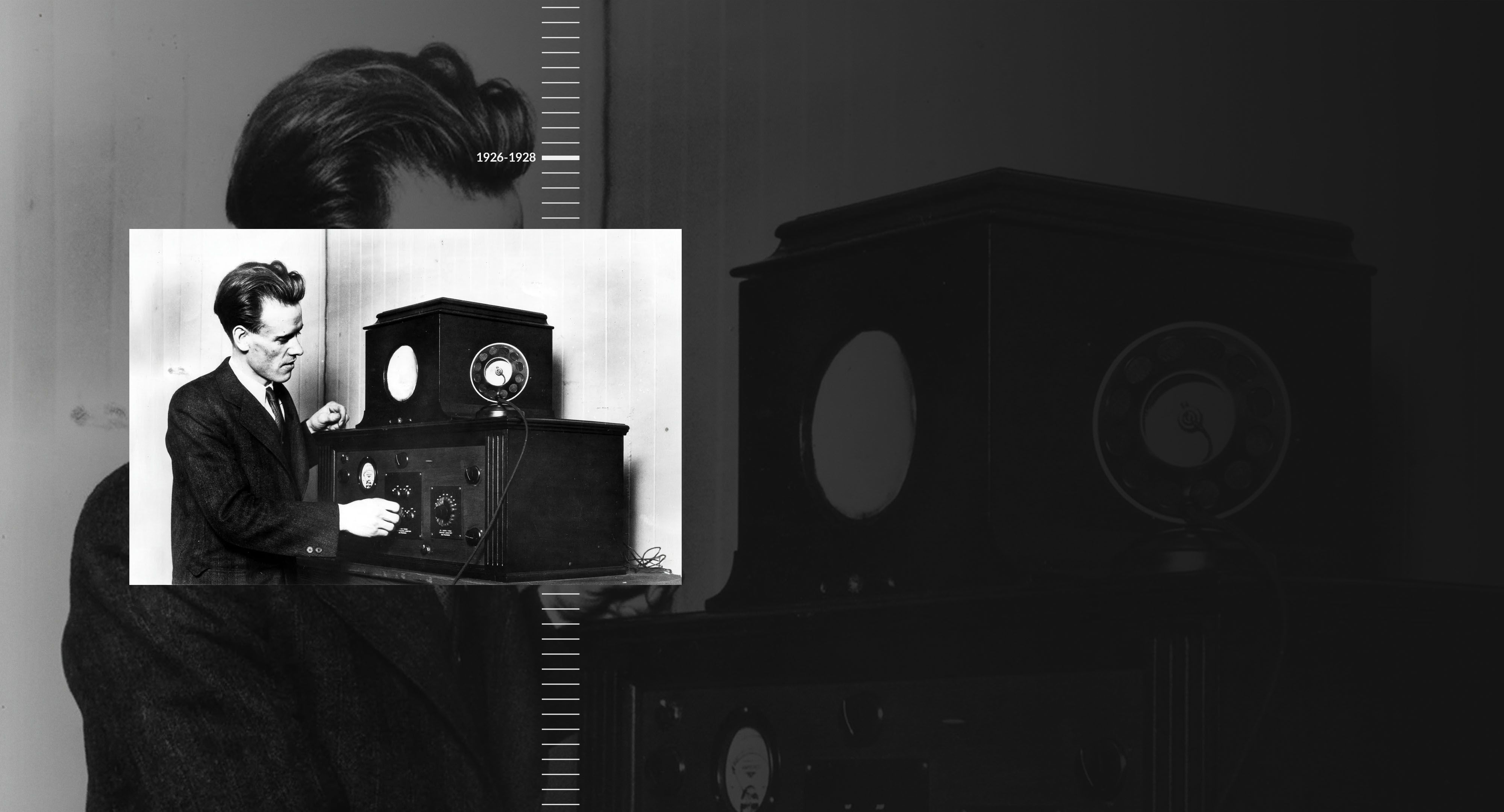 Inventor stands with early television.