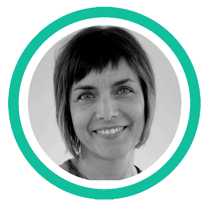 A black and white headshot of a woman with a straight bob haircut.