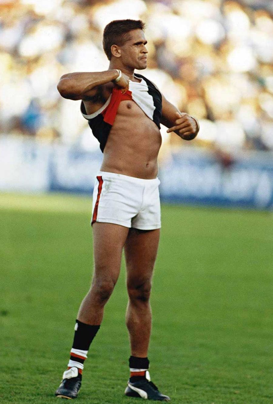 1993 photo of Nicky Winmar on a verdant green footy field