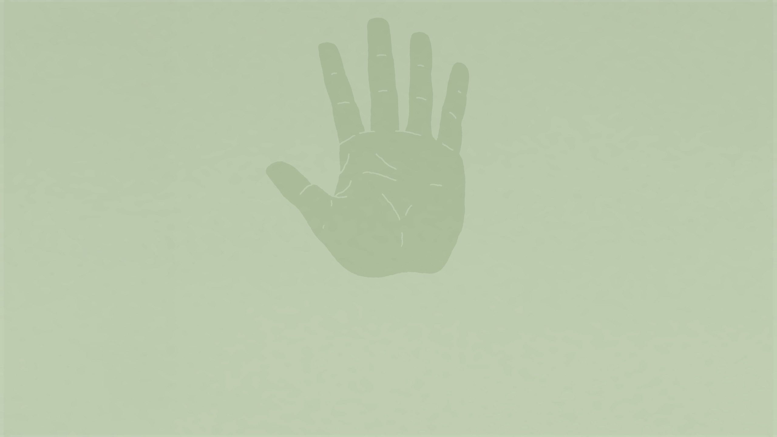 A hand on a green background