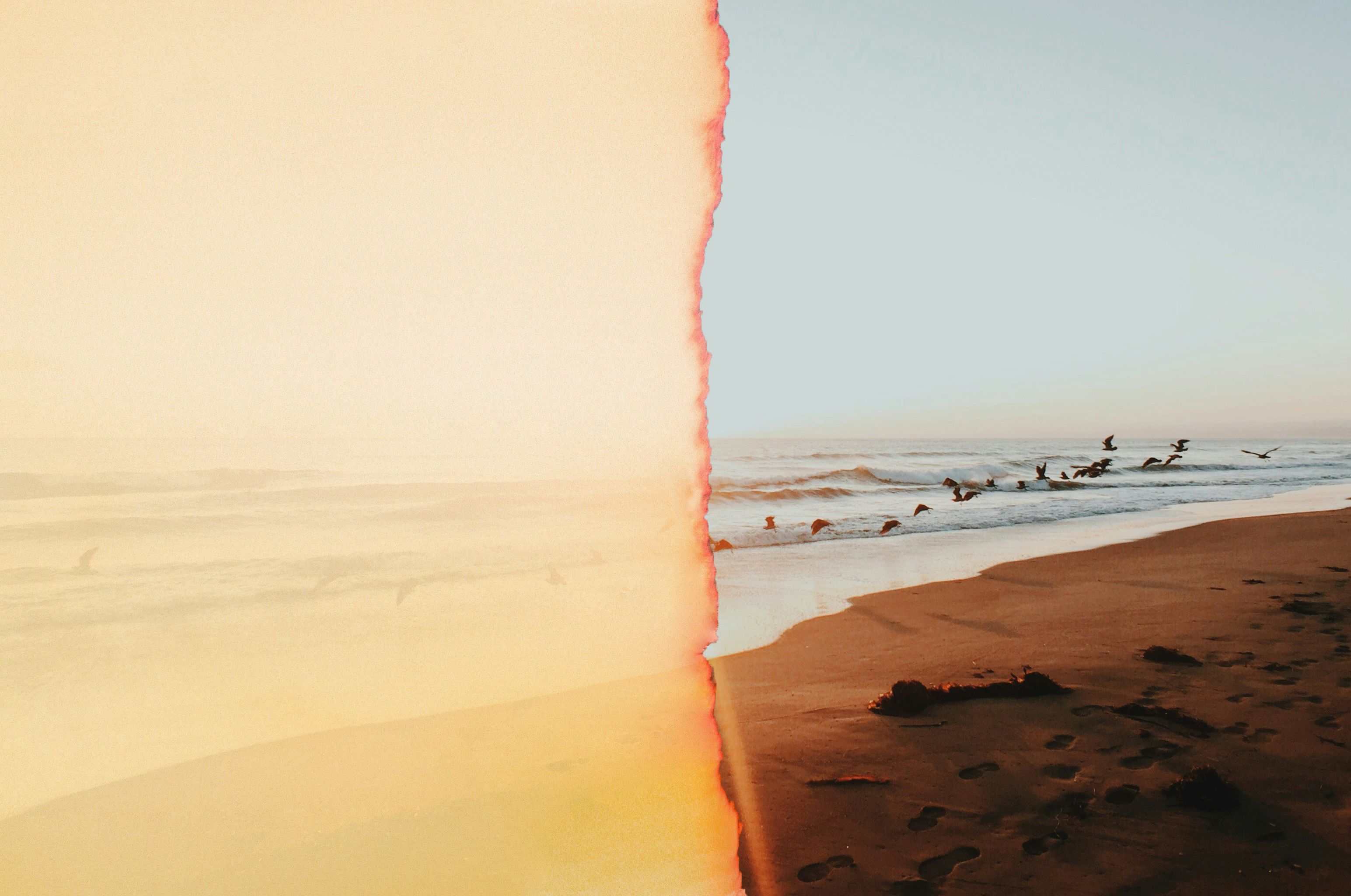 ocean waves crashing on shore during sunset