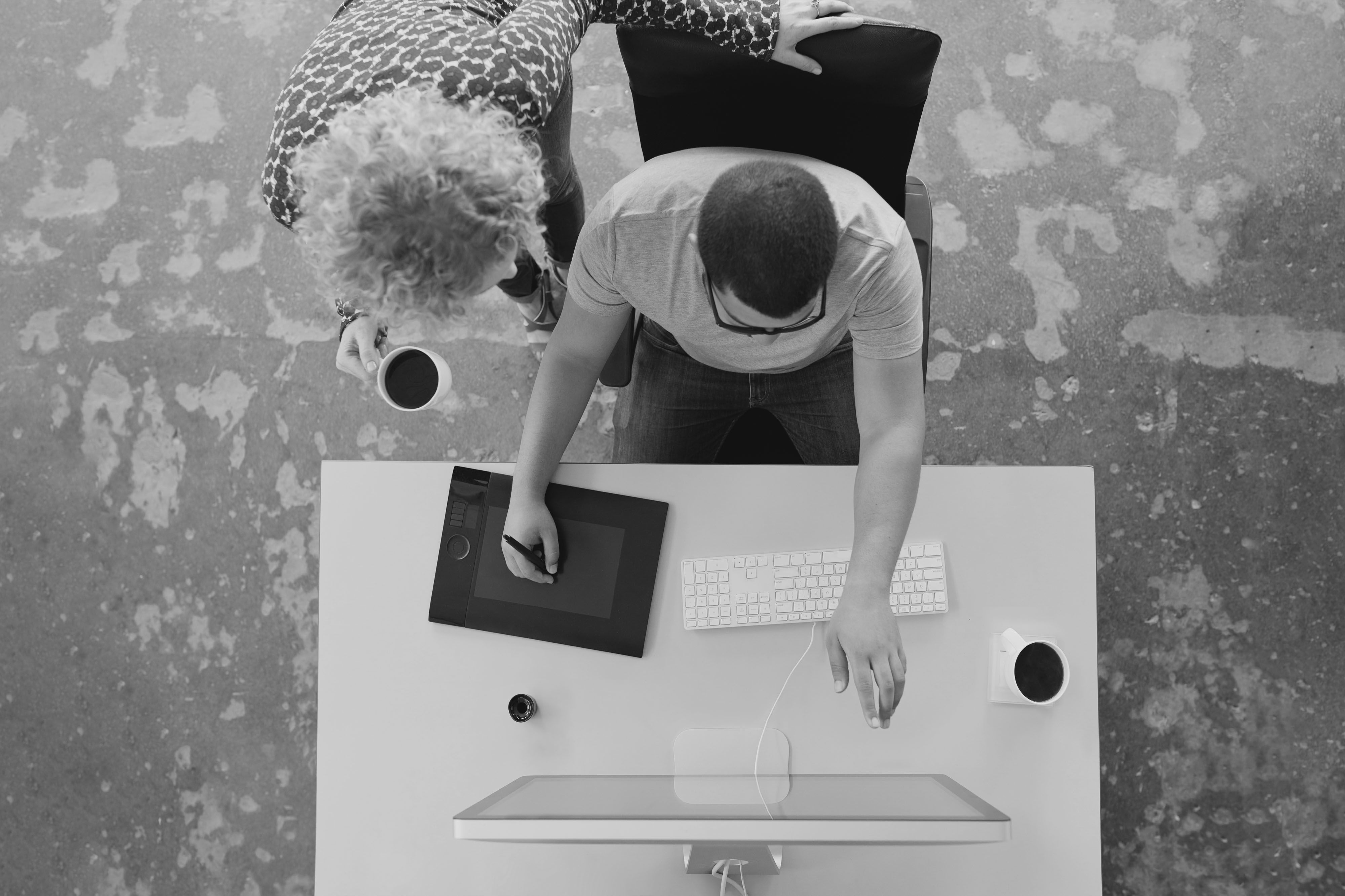 Photo of a person building a pitch deck on a computer