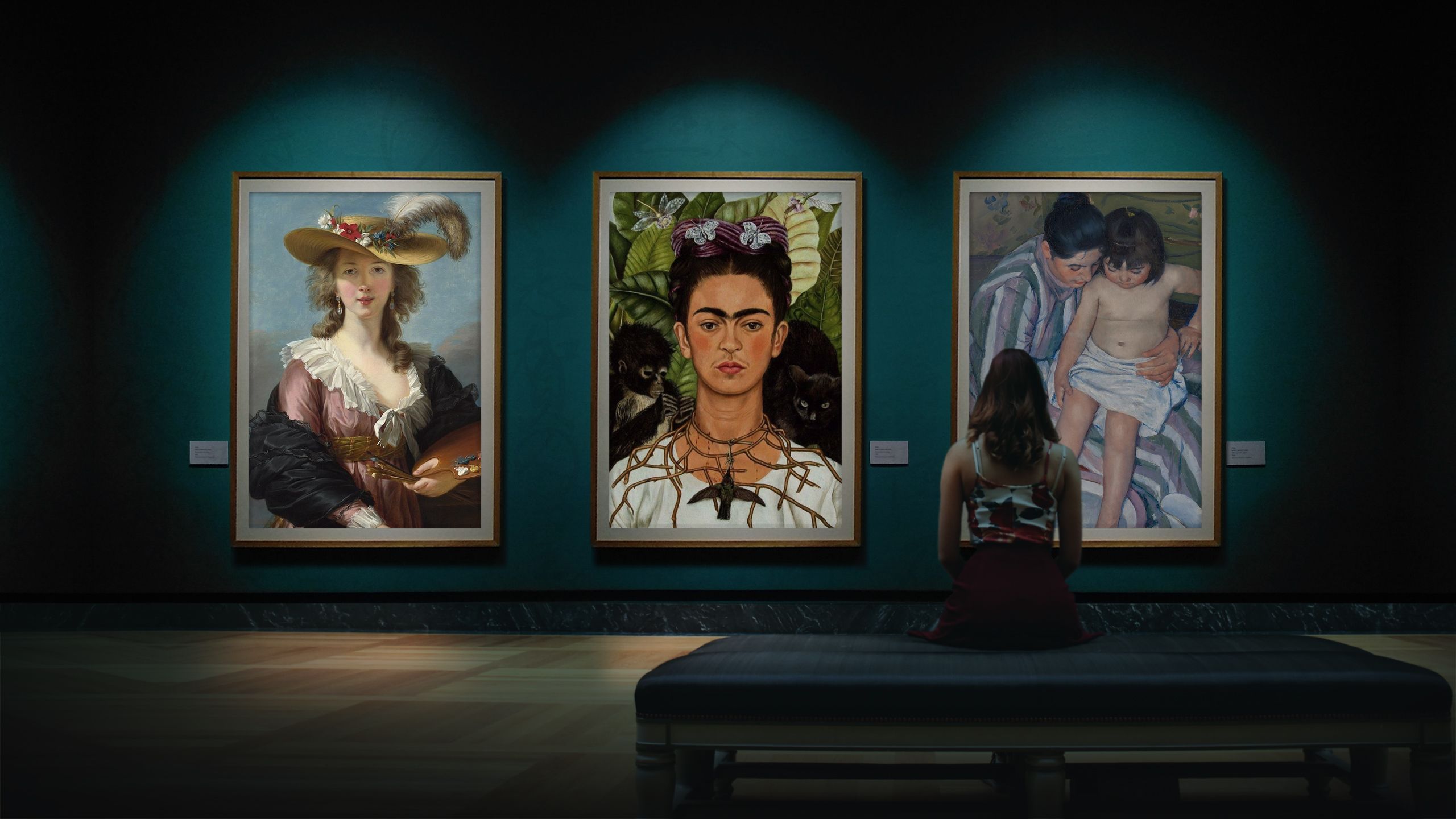 Woman standing in front of three paintings in a gallery