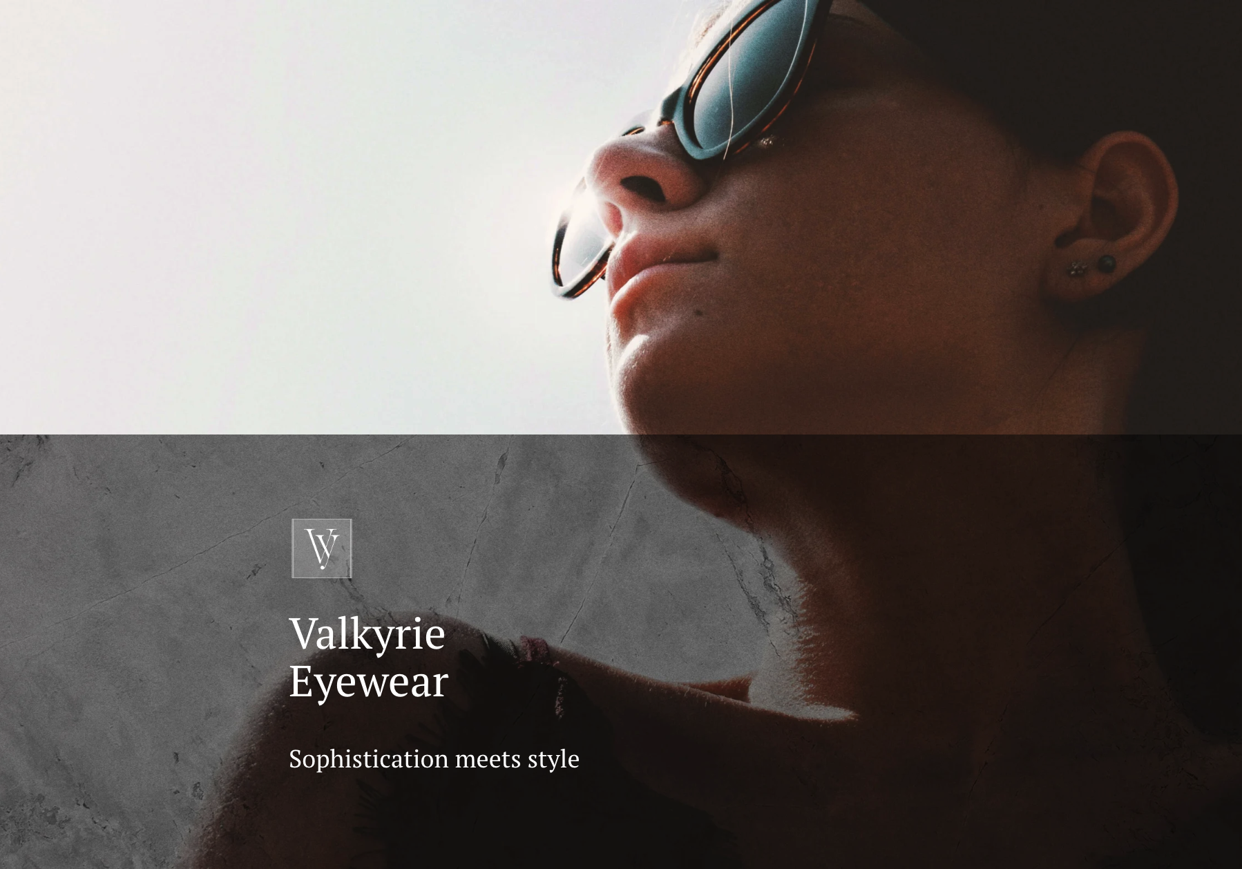 A white woman with black hair modelling sunglasses.